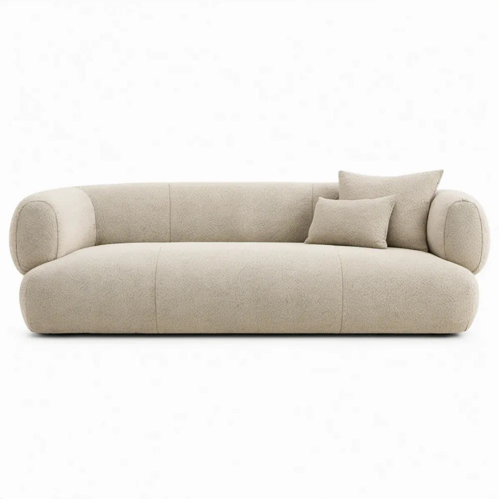 Crèmekleurige gebogen bouclé 3-zitsbank met 2 sierkussens, 225 x 95 x 72 cm